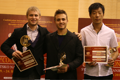 Petar Maric, Serbia (center), Alexander Veretennikov, Russia (left), Liang Tan Jia, China (right)