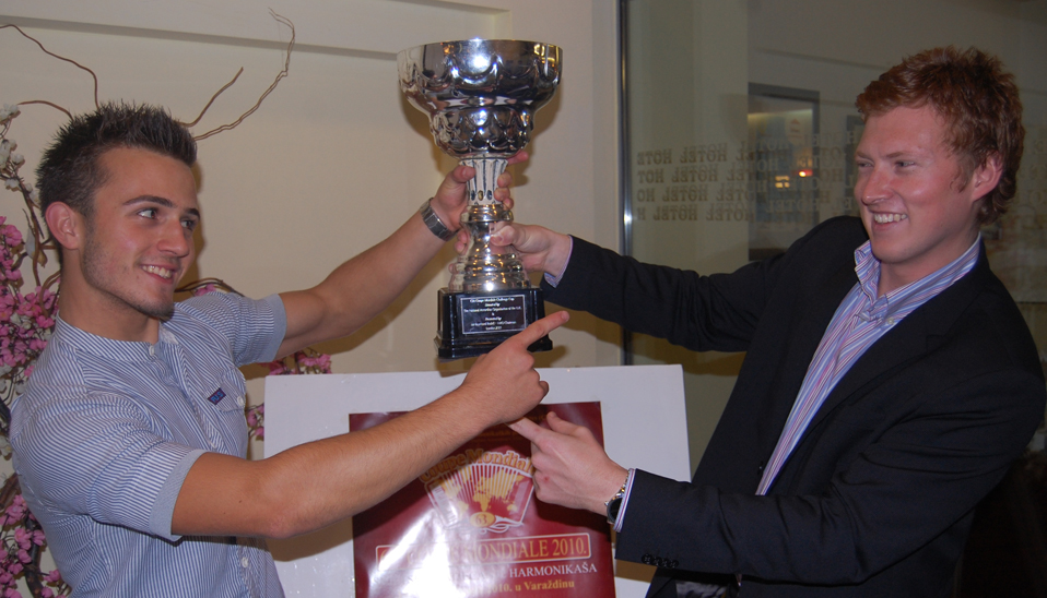 63rd Coupe Mondiale Champion Petar Maric (Serbia) being handed the Coupe Mondiale Tropy by current World Champion Grayson Masefield (New Zealand)